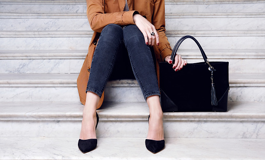 Fashion Woman Sit In High Heels Shoes Hold Black Big Bag Stock Photo -  Download Image Now - iStock
