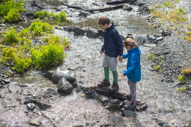 istock Family River Crossing in National park 947156234