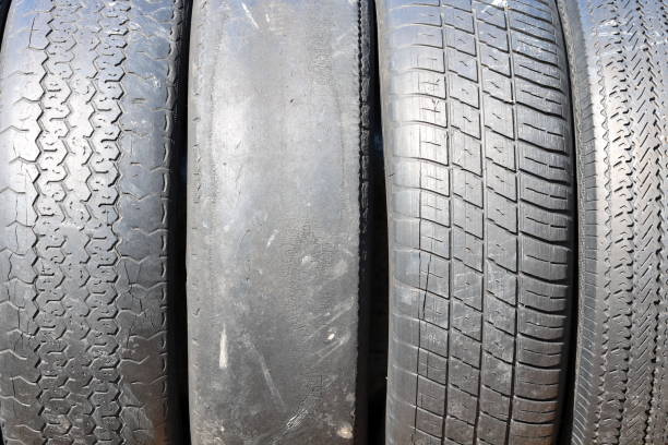 istock worn out bald old car tire close-up 947156260