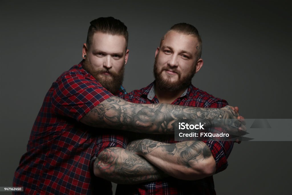 Two Guys In Red Shirts With Beards And Tattoos Stock Photo - Download Image  Now - Men, Muscular Build, Tattoo - iStock