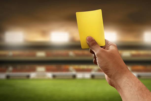 istock Soccer referee hand holding yellow card 947162548