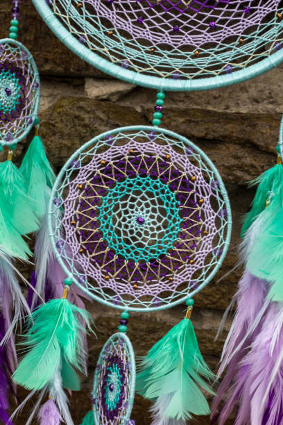 istock Handmade dream catcher with feathers threads and beads rope hanging 947163244
