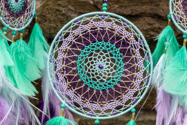 istock Handmade dream catcher with feathers threads and beads rope hanging 947163248