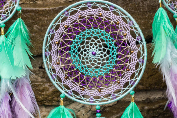 istock Handmade dream catcher with feathers threads and beads rope hanging 947163304