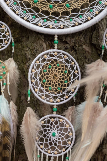 istock Handmade dream catcher with feathers threads and beads rope hanging 947163526