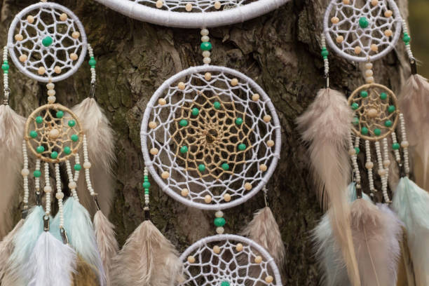 istock Handmade dream catcher with feathers threads and beads rope hanging 947163636