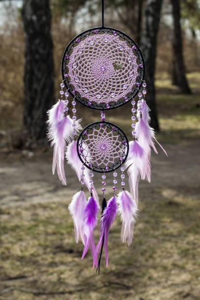 istock Handmade dream catcher with feathers threads and beads rope hanging 947163764