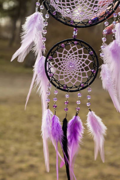 istock Handmade dream catcher with feathers threads and beads rope hanging 947163806