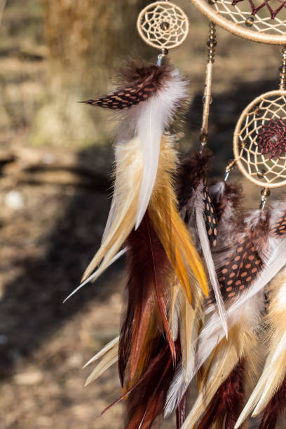 istock Handmade dream catcher with feathers threads and beads rope hanging 947164164