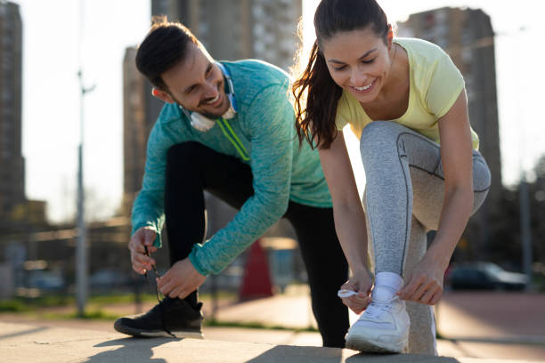 istock Athletic couple jogging together 947164234