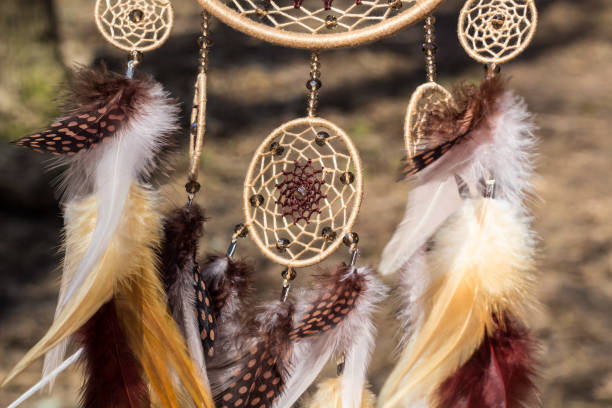 istock Handmade dream catcher with feathers threads and beads rope hanging 947164246