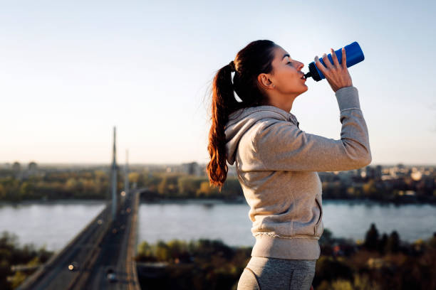 istock Portrait of woman taking break from jogging 947166542
