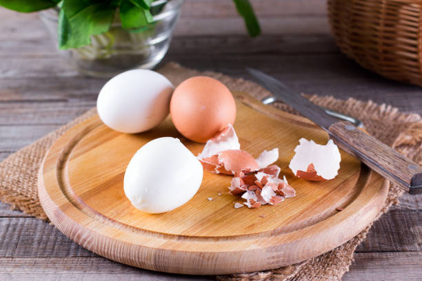 istock Peeled boiled eggs on wooden background 947170840