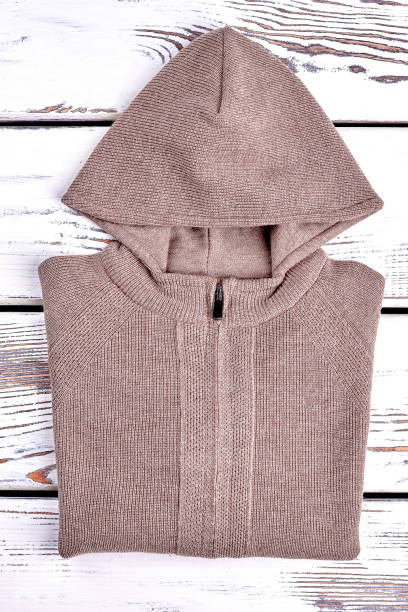 istock New beautiful knitted hooded cardigan. 947171190