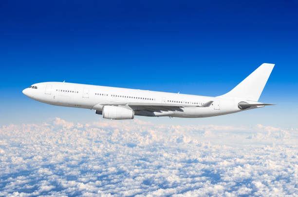 istock Passenger airplane fly on a hight above overcast clouds and blue sky. 947174676