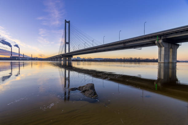 istock Beautiful glowing bridge over the river 947177902