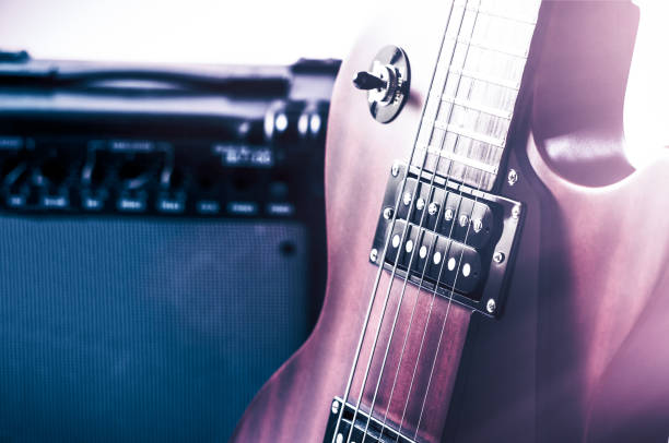 istock Part electric guitar and classic amplifier on a dark background 947178106