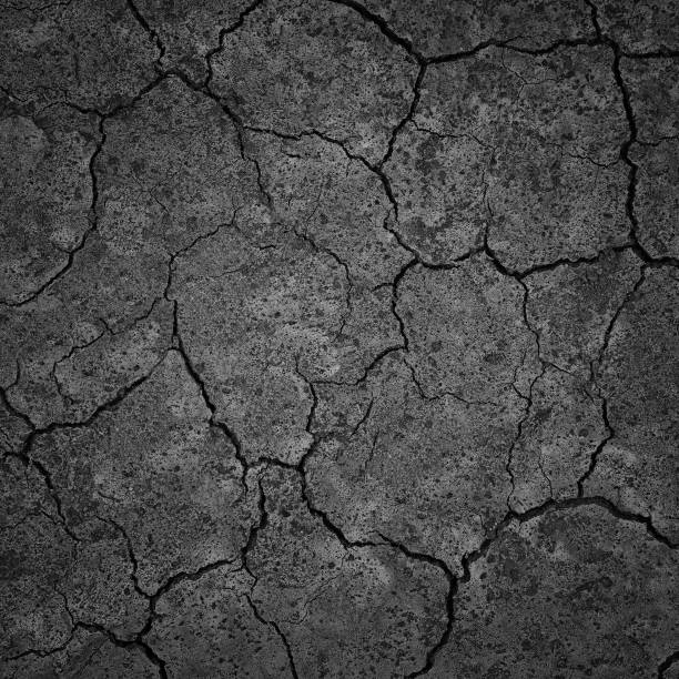 istock Black Dry Drought Land with Chaps as Natural Background 947181442