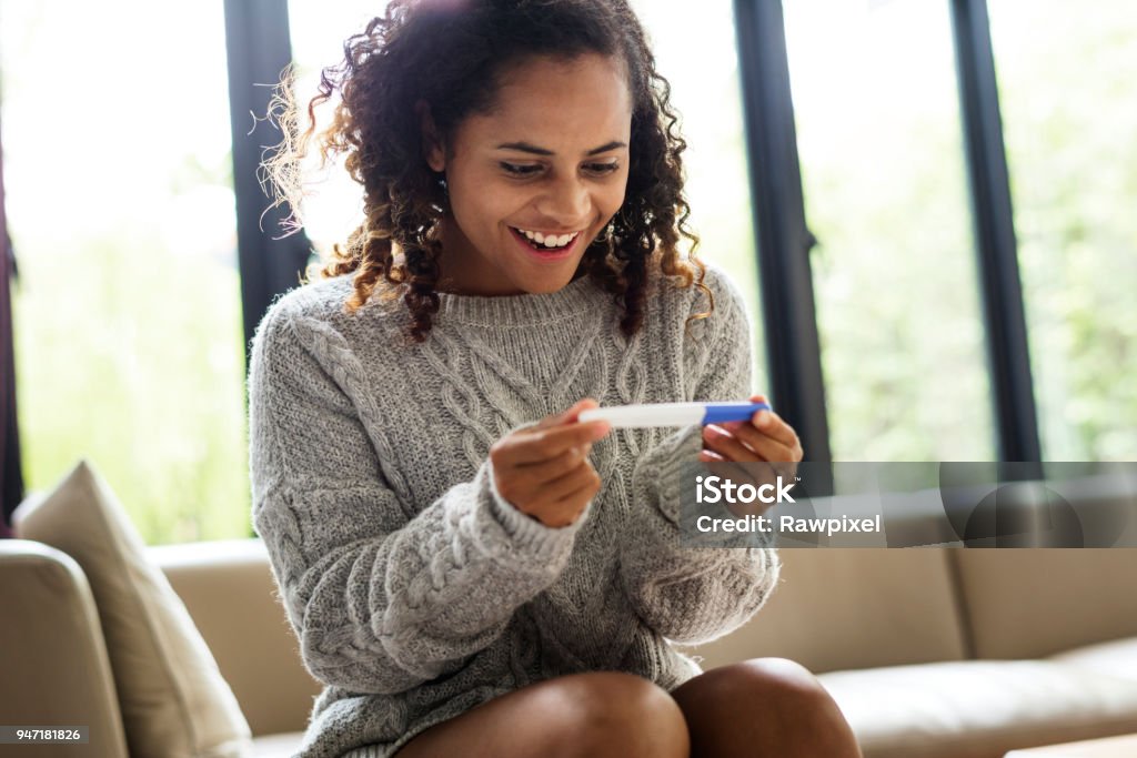 Woman with a pregnancy test Pregnancy Test Stock Photo