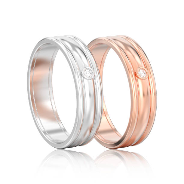 istock 3D illustration isolated two rose gold and silver matching couples wedding rings with reflection 947182300