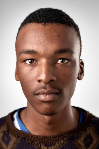 istock ID passport portrait of African with serious expression 947189132