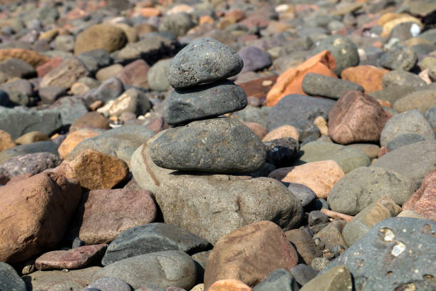 istock Stacked Seaside Rocks on a Coastal Beach 947189340