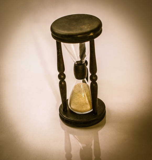 istock hourglass on dark background.the concept of time 947196358