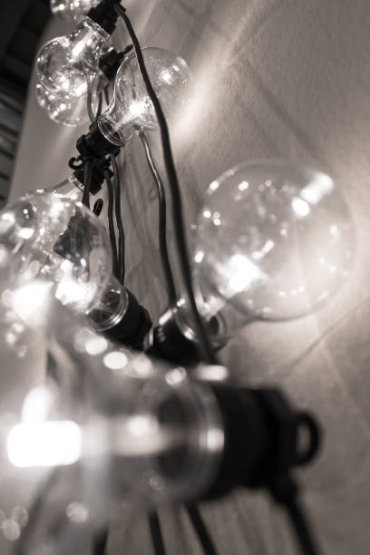 istock Vintage style light bulbs hanging from the wall 947197032