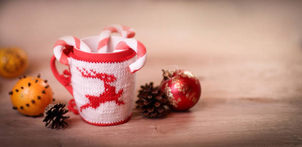 istock Christmas Cup and oranges on wooden background blurred 947197308