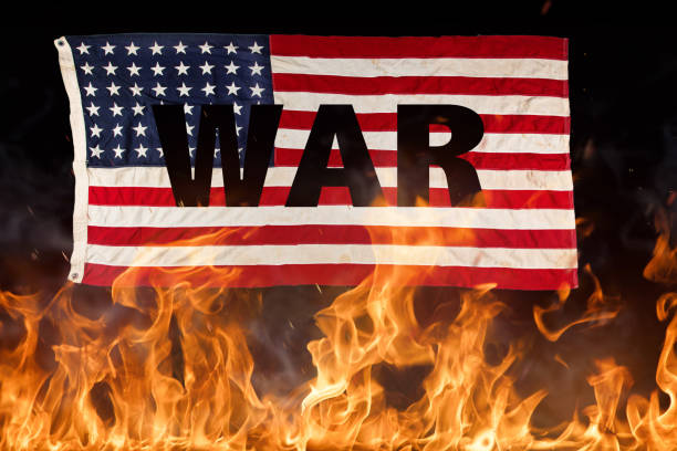 istock Grunge American flag, war concept with fire flames 947206612