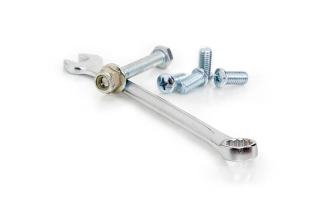 istock Combination wrench among of bolts, screws,  nuts at selective focus 947206836