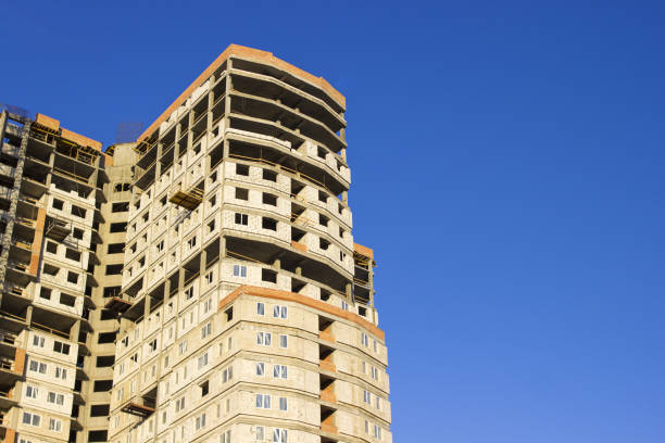 istock Skyscraper in the process of construction. Construction crane. Home construction 947209698