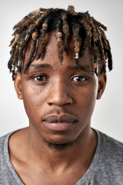 istock Student ID passport portrait of African man with serious blank expression 947212106