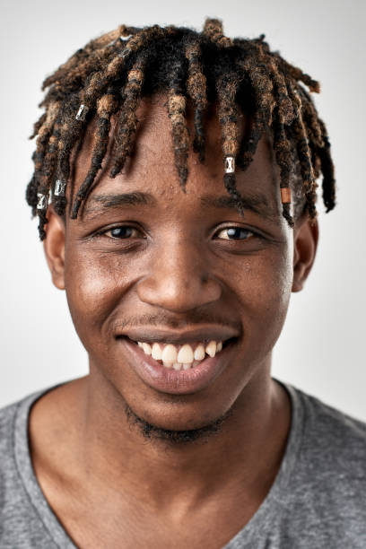 istock Studio portrait of young African student man smiling 947212264