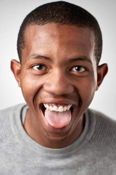 istock Studio portrait of African youth man making silly fun expression 947212688