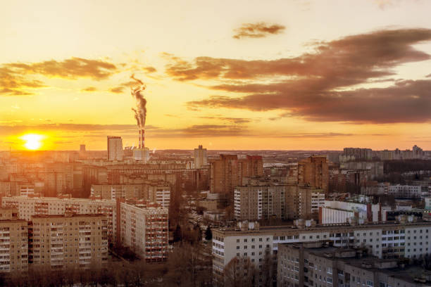 istock Environmental problem of environmental pollution and air in large cities. Sunny sunset. Air pollution. The city from above 947213204