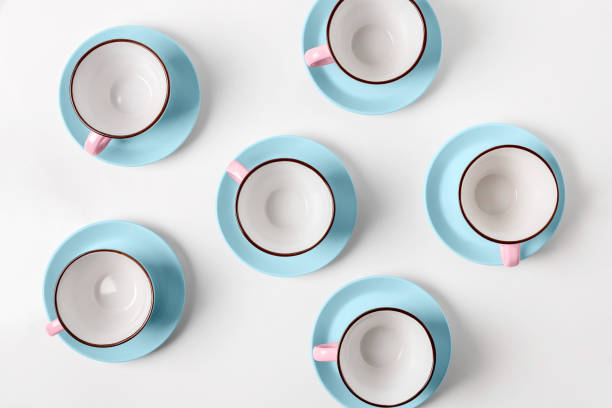 istock Elegant porcelain blue and pink cups on abstract background 947217628