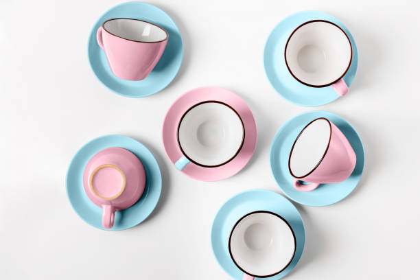 istock Elegant porcelain blue and pink cups on abstract background 947217658