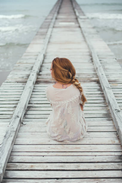 Dreamy girl on beach