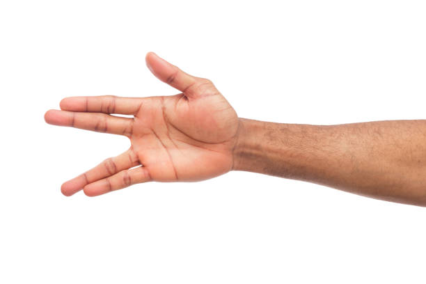 istock Black man hand gesturing in the form of crocodile 947223684