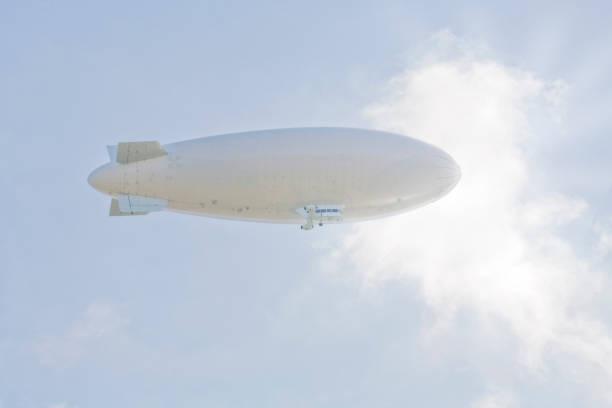 istock zeppelin airship against clouds, free copy space 947224818
