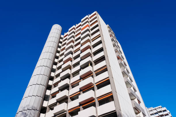 istock Apartment building and clear sky 947227506