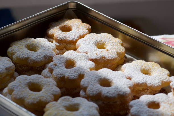 homemade fresh canestrelli biscuits in a metallic box ready for a present