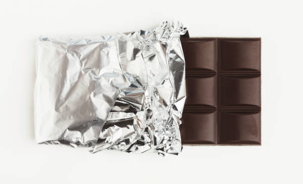 istock Bar of dark chocolate isolated on white 947228800