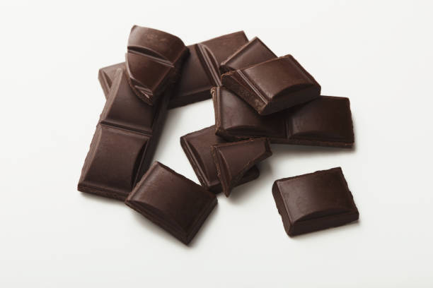 istock Bar of dark chocolate isolated on white 947228826