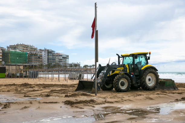istock Tractor clean beach on coastline Costa Dorada, Salou, Spain 947229194