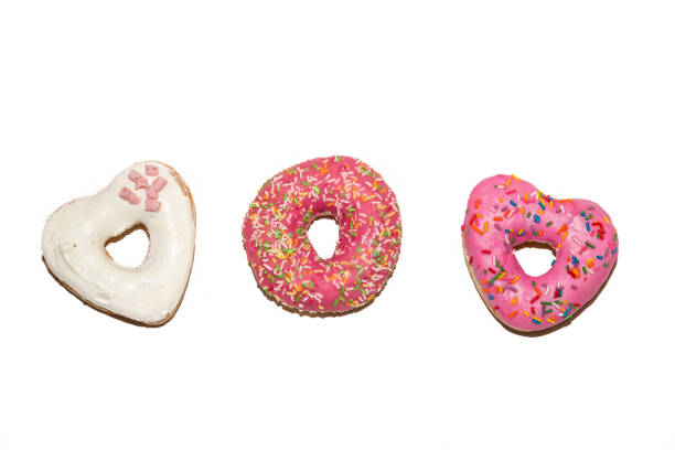 istock Strawberry glazed donuts isolated on a white background. Top view. 947230698