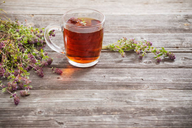 istock tea with thyme on old wooden background 947233092