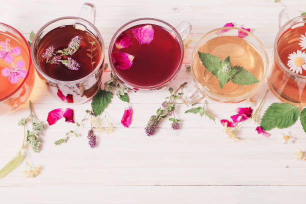 istock herbat tea in cups on white wooden background 947233162