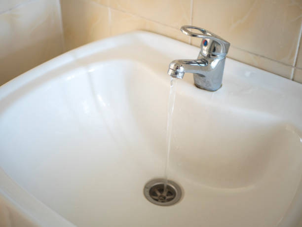 istock chrome crane on the ceramic wash basin in the bathroom close up 947234526